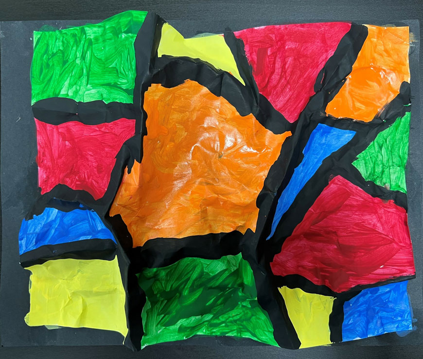 A geometric rainbow 3D paper sculpture.