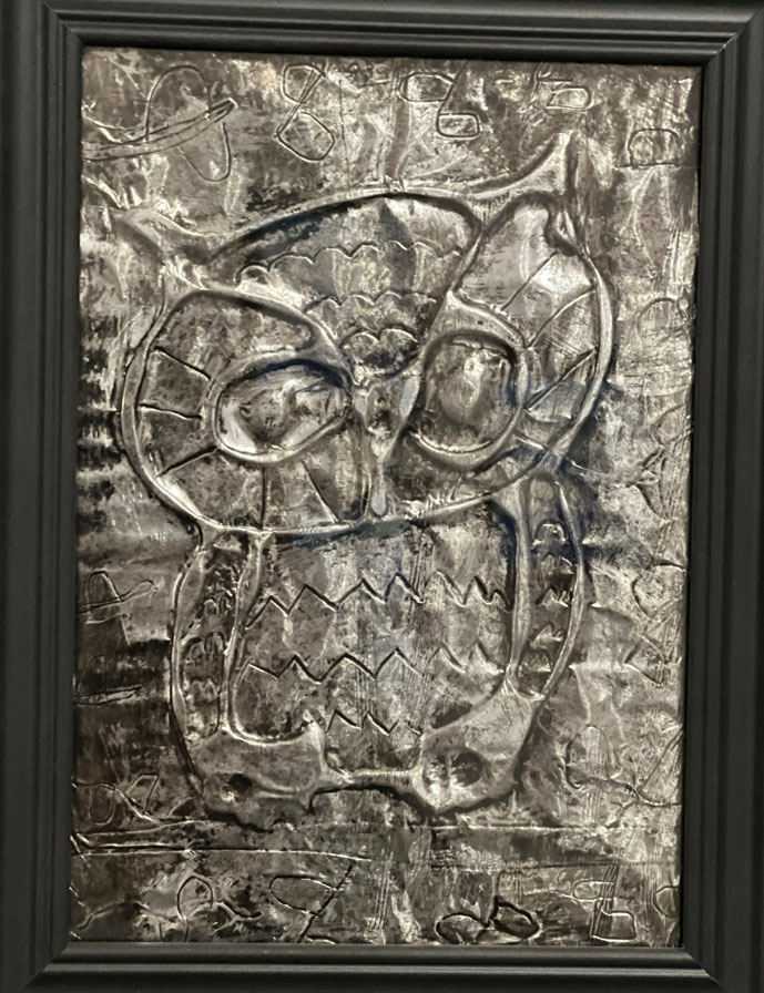 A foil art piece of an owl.